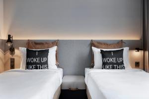 Posteľ alebo postele v izbe v ubytovaní Moxy Vienna City East