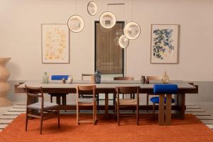 a dining room with a table and chairs at Hôtel Parc du Landreau in Les Herbiers