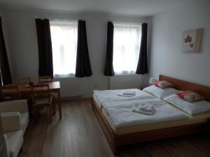 Postel nebo postele na pokoji v ubytování Dueta Apartment