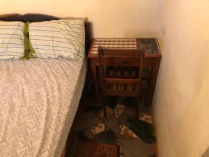 سرير أو أسرّة في غرفة في Residencial Meu Tio