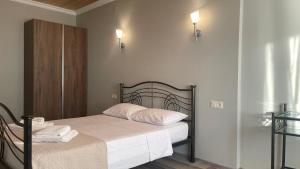 Postel nebo postele na pokoji v ubytování Argo Hotel