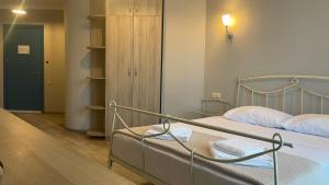 Postel nebo postele na pokoji v ubytování Argo Hotel