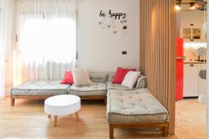 a living room with a couch and a table at Rock Garden Apartment in Arco