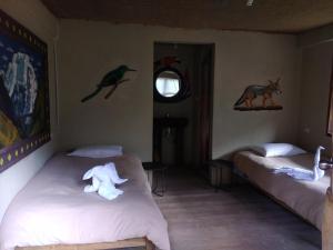Postel nebo postele na pokoji v ubytování Salkantay Hostel Chaullay
