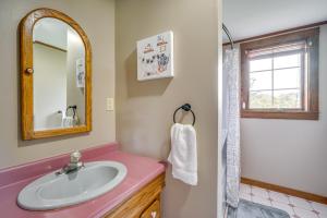 a bathroom with a sink and a mirror at Buskirk Vacation Rental with Deck and Putting Green! in Buskirk +31 photos