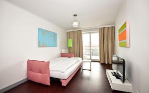Łóżko lub łóżka w pokoju w obiekcie Stanys - Das Apartmenthotel