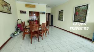 a dining room with a table and chairs in a restaurant at Bistari Single Room, FEMALE guests only, Free wifi in Kuala Lumpur