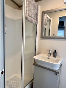 a bathroom with a sink and a shower at Woodview Retreat 