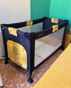 a small blue bunk bed with a glass table at VERONA CENTRO MARIA's HOUSE in Verona