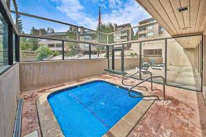 a swimming pool on the back of a building at Main Street Retreat in Winter Park