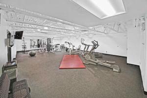 a gym with some exercise equipment in a room at Main Street Retreat in Winter Park