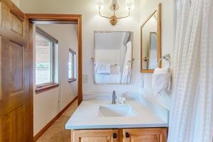 a bathroom with a sink and a mirror at Blue River Grove in Silverthorne +40 photos