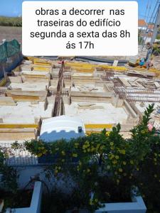 a view of a construction site with a white car in the middle at T2,Casa Sol e Mar 50464/AL in Vila Nova de Milfontes