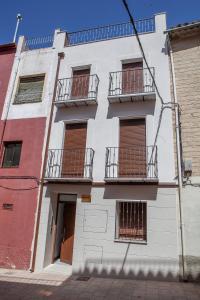 an apartment building with balconies on a street at VTAR Puerta Del Sol in Villacarrillo