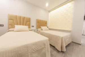Llit o llits en una habitació de VTAR Puerta Del Sol