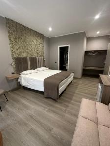 Postel nebo postele na pokoji v ubytování B&b Sanem Luxury rooms