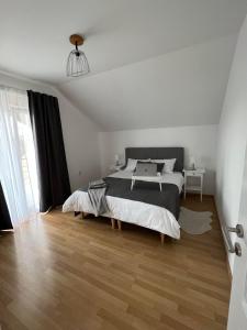 Postel nebo postele na pokoji v ubytování Apartman Magnolia