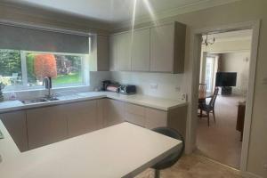 a kitchen with a sink and a counter top at Number Fifty-Six Ramsey Villa in Ramsey