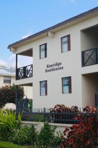 a white building with the words marriage residence on it at Kenridge Residences in Saint James