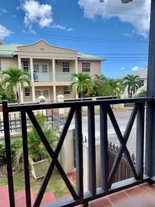 a view of a house from a balcony at Kenridge Residences in Saint James