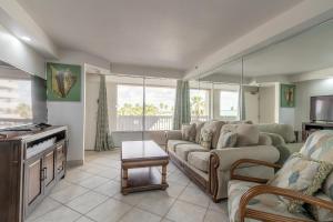 a living room with a couch and a table at DBR Direct Oceanfront Condo, Daytona Beach, sleeps 6 in Daytona Beach
