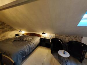 Postel nebo postele na pokoji v ubytování Au Ch'ti Suisse