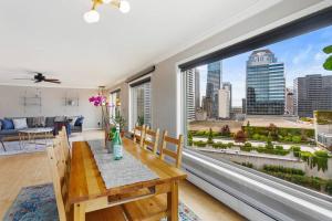 a dining room with a table and a large window at Private Penthouse in the heart of Seattle with views in Seattle