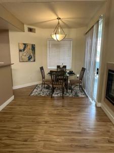 a dining room with a table and chairs at 2BR Condo 15 mins to Downtown Phoenix with Pool & Spa in Phoenix