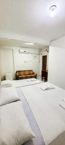 Postel nebo postele na pokoji v ubytování Hotel Porto da Lua Belém