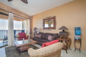 a living room with a couch and a table at Sonoran Sun 2BR SE 703 by Casago in Puerto Peñasco