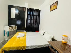 Postel nebo postele na pokoji v ubytování Shree Balaji Homestay + 8 fotografií