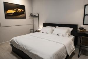 a bedroom with a bed with a car on the wall at FAST FIVE At Gurney in Tanjong Tokong