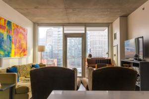 a living room with a view of a city at 2BR Executive Suite With Fast Wi-Fi in Chicago