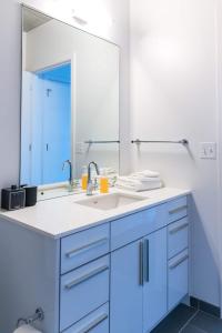 a bathroom with a sink and a mirror at 2BR Executive Suite With Fast Wi-Fi in Chicago