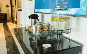 a glass shelf with a large jar on top of it at BTH Hotel Lima Golf in Lima