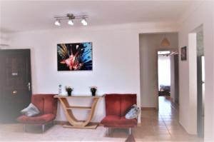 a living room with a table and two chairs at Luxury & stylish Naama bay flat at the centre of Sharm in Sharm El Sheikh