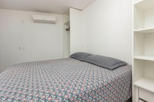 Cama o camas de una habitación en Apartamento frente ao Mar Mariscal 4 pessoas