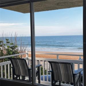 a view of the beach from a balcony at Sapphire Shores- Oceanfront at Symphony Beach Club in Ormond Beach