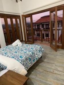 Postel nebo postele na pokoji v ubytování Villa del Carmen