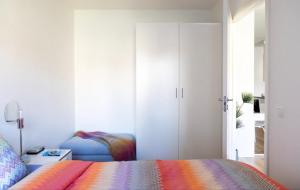 a bedroom with a bed and a closet at Fresh and cosy apartment in the center of the city in Stockholm