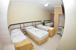 Posteľ alebo postele v izbe v ubytovaní Eldorado Palace Hotel