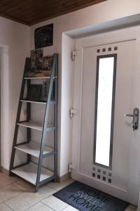 a room with a ladder next to a door at Home Sweet Home in Reichersdorf