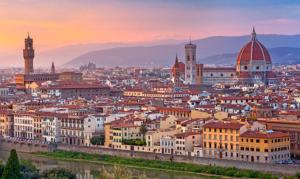 a view of a city at sunset with buildings at Come a casa in Monsummano