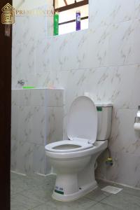 a bathroom with a white toilet in a room at Premier Stays Ruiru in Ruiru
