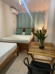 Łóżko lub łóżka w pokoju w obiekcie Hostel Travelers Chitre