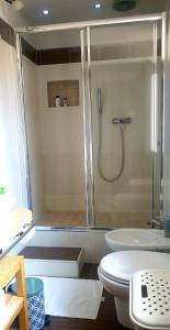a bathroom with a shower and a toilet at La Casita in Reggio di Calabria