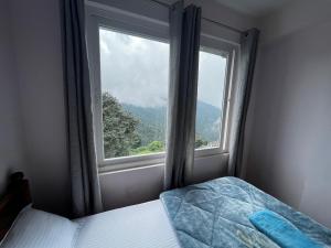 Postel nebo postele na pokoji v ubytování Pratha Homestay