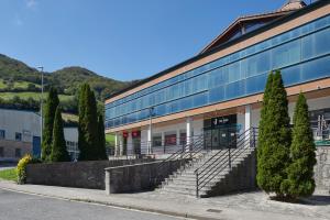 a building with trees in front of it at Leizarooms in Leitza