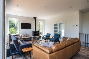 TV a/nebo společenská místnost v ubytování Chalet Alpine by Tremblant Platinum