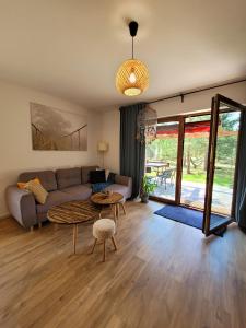 a living room with a couch and a table at Borsk Sielanka in Borsk